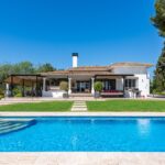 Luxury second home in Marbella featuring modern Mediterranean architecture, landscaped gardens and private swimming pool, showcasing the Costa del Sol lifestyle for overseas property buyers.